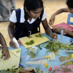 photo of Sri Lankan students working on their collages