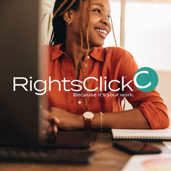 featured image showing a smiling designer with the RightsClick logo superimposed